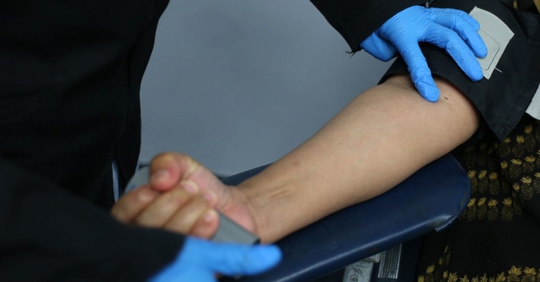 Woman having to give blood after being charged with a DUI in Tennessee.